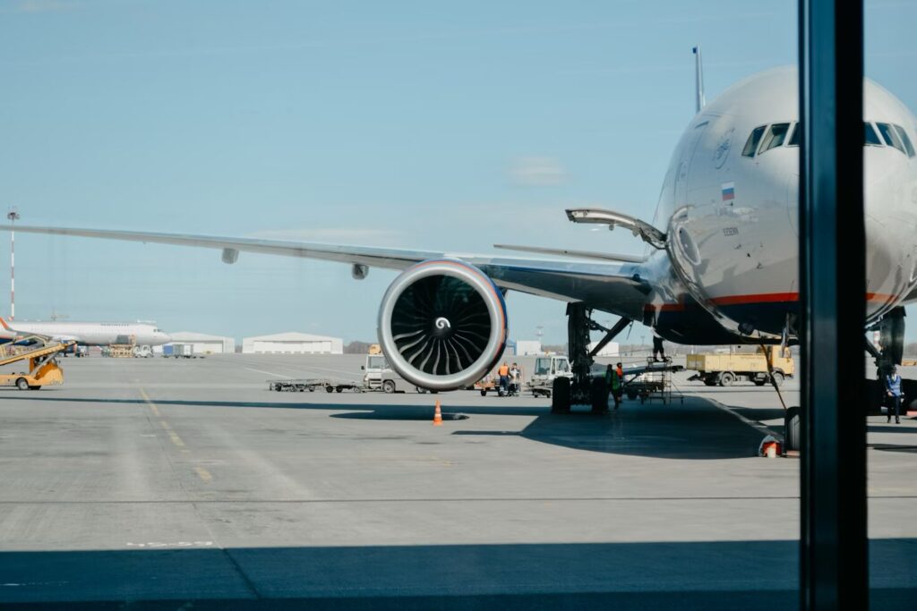 an airplane undergoing checks at an airport