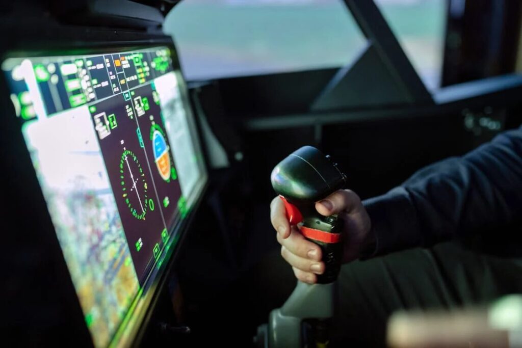 A student pilot learning aircraft controls in a virtual flight simulator