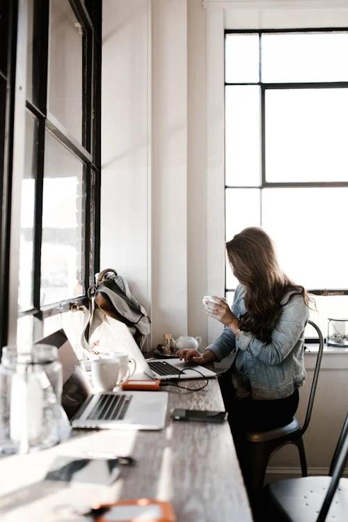 Student studying aviation systems on a laptop in a home setting