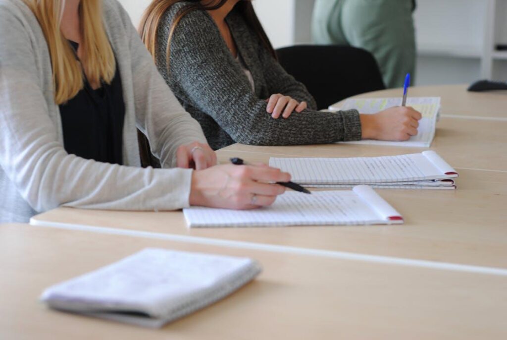 Students in an aviation training classroom studying aircraft maintenance systems
