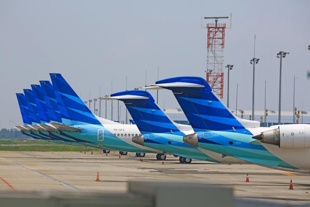 Lineup of multiple aircraft models on an airport tarmac