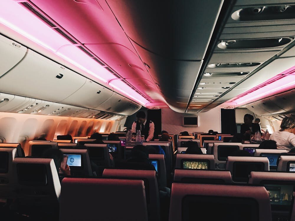 Modern aircraft cabin interior with lightweight seating and LED lighting