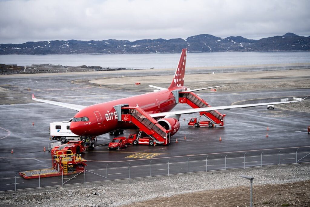 A330 aircraft parked in a bustling maintenance hangar