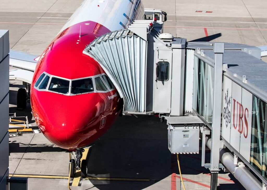 Airbus A320 aircraft lined up at airport gates
