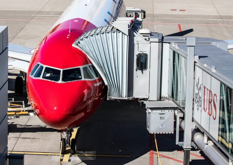 Airbus A320 aircraft lined up at airport gates